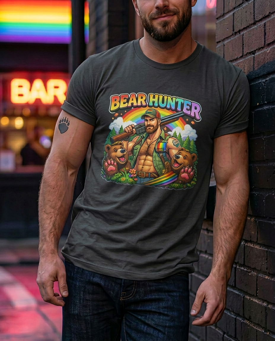 Man wearing a t-shirt with 'Bear Hunter' graphic design in an urban setting. X Collection: Bear Hunter Tri-Blend Graphic Tee. Funny gay t-shirts and pride shirts by Pride Clothing Co.