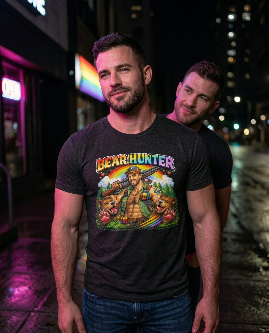 Man wearing a t-shirt with 'Bear Hunter' graphic design on a city street at night. X Collection: Bear Hunter Tri-Blend Graphic Tee. Funny gay t-shirts and pride shirts by Pride Clothing Co.
