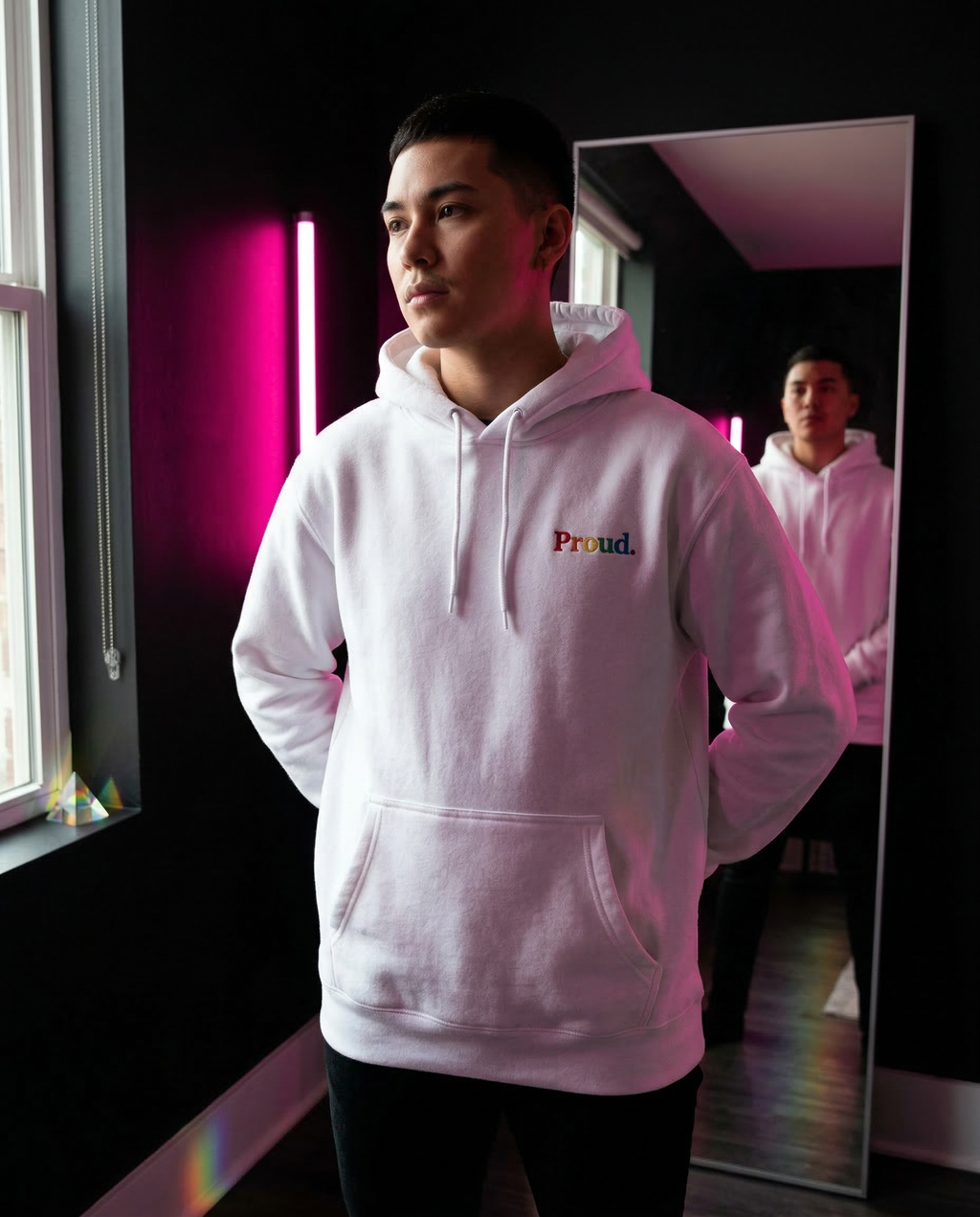 Person wearing a white hoodie with 'Proud.' text, standing in front of a mirror. Proud Premium Pullover Hoodie