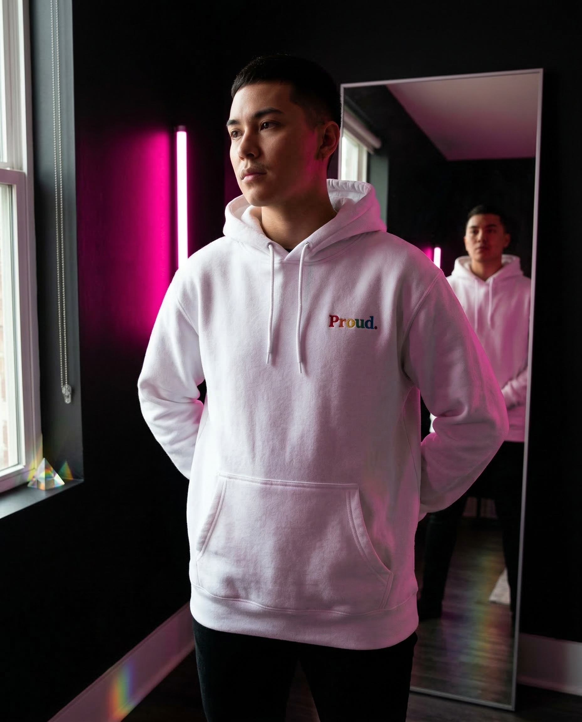 Person wearing a white hoodie with 'Proud.' text, standing in front of a mirror. Proud Premium Pullover Hoodie